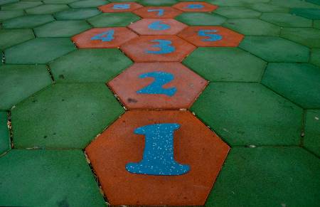 A hopscotch board on a playground.